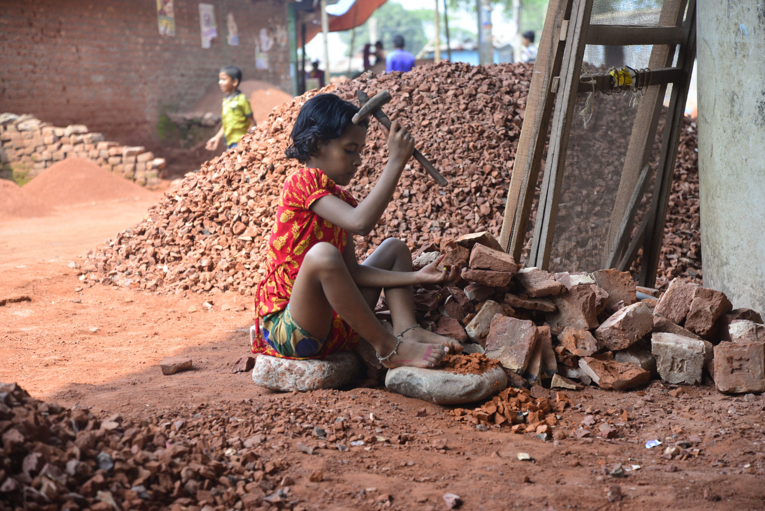 A,Bangladeshi,Child,Break,Bricks,At,Demra,Brick,Breaking,Yard