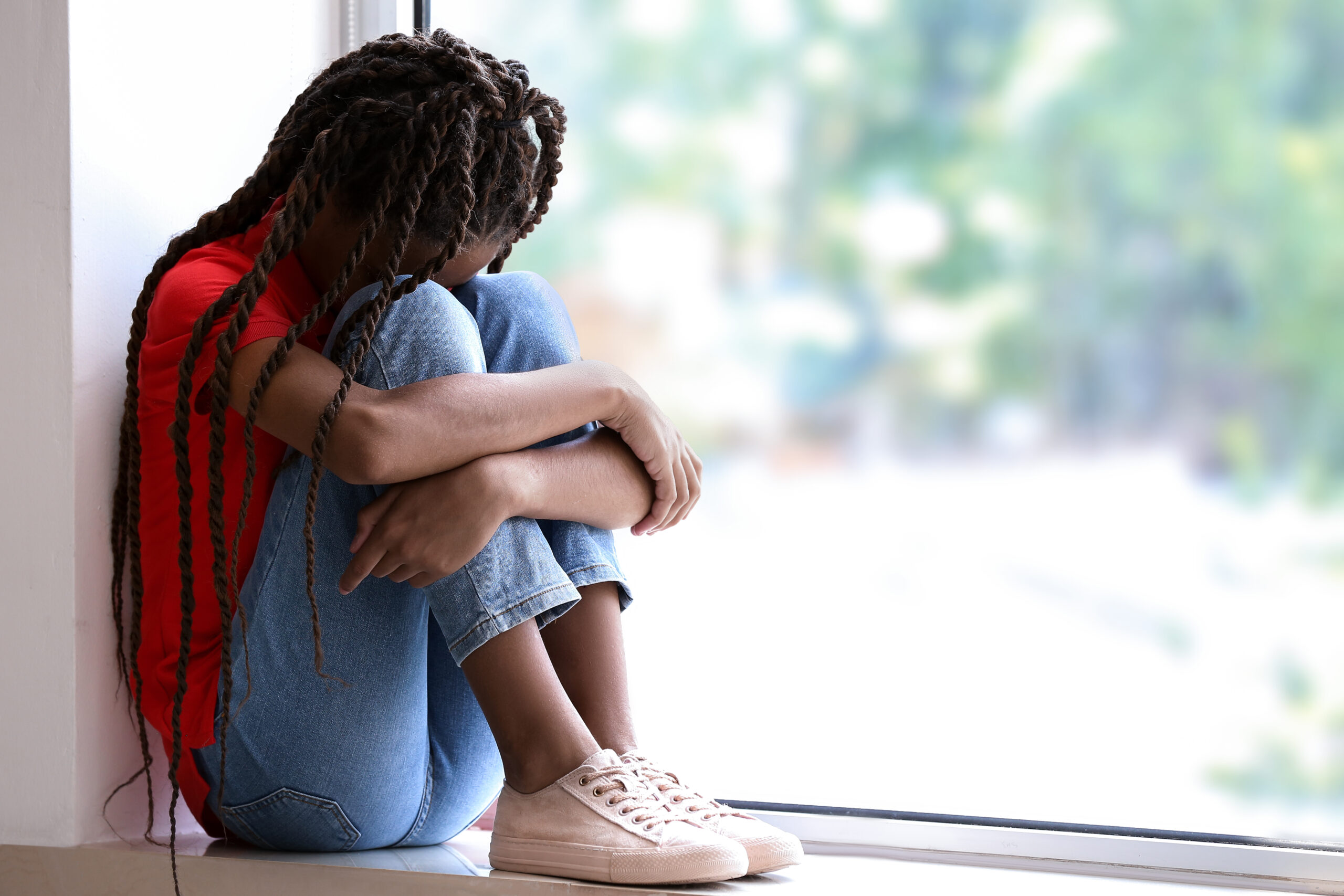Sad,African-american,Girl,Sitting,On,Windowsill.,Stop,Racism