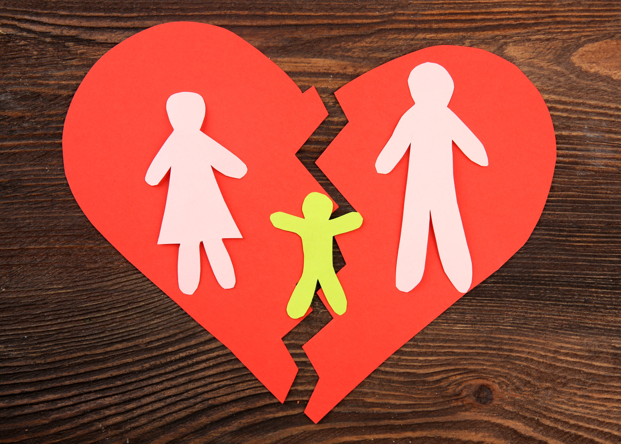 Paper,Cutout,Silhouette,Of,A,Family,Split,Apart,On,A