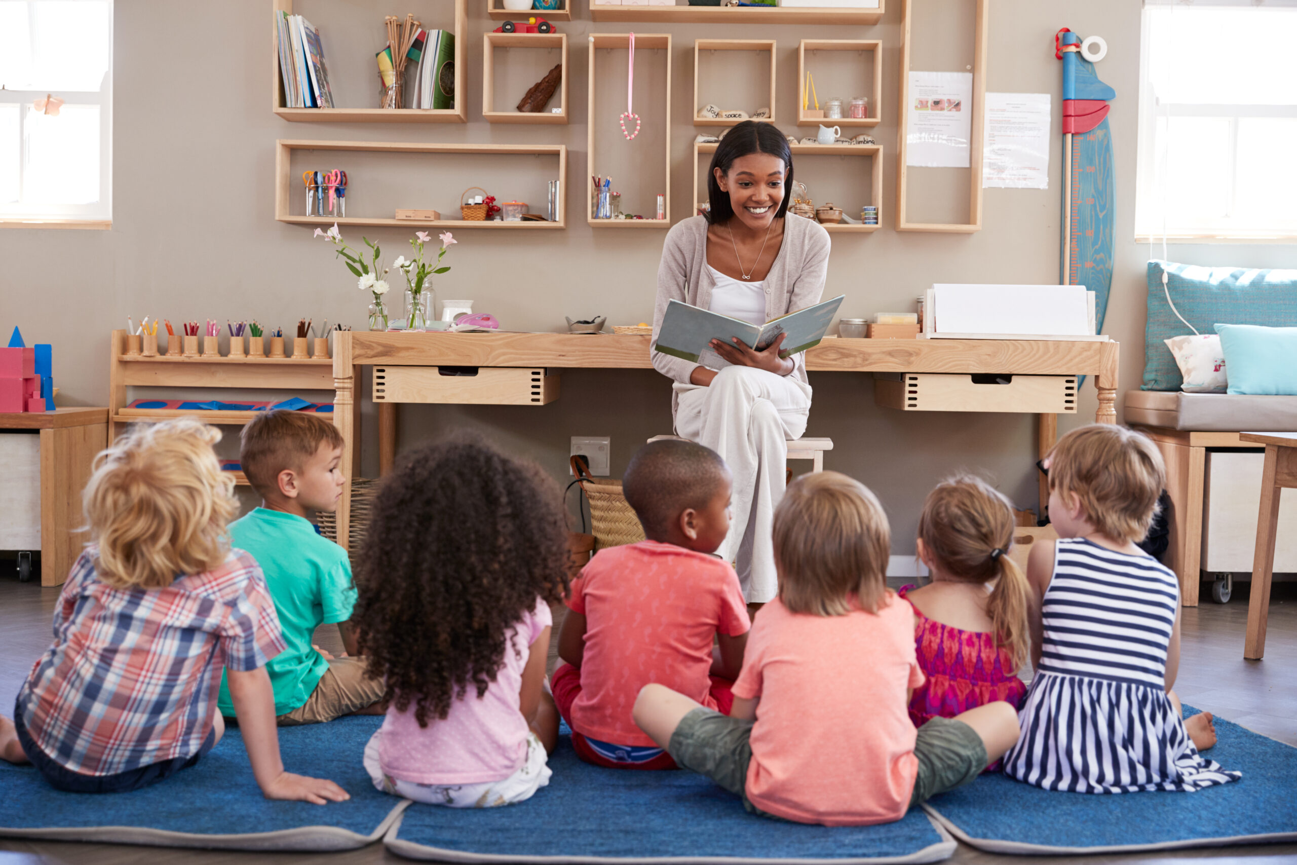 Teacher,At,Montessori,School,Reading,To,Children,At,Story,Time